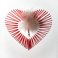 embroidery thread in paper in the shape of a heart